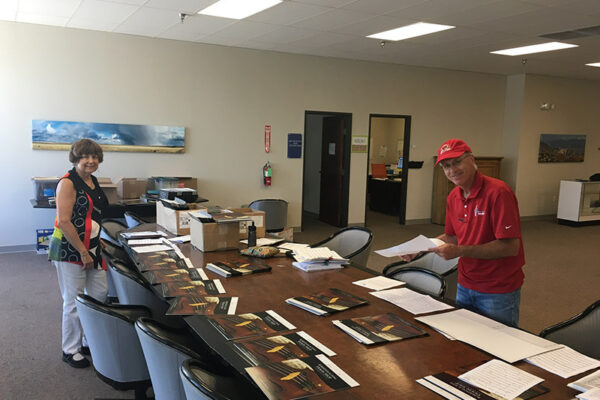 people organizing papers