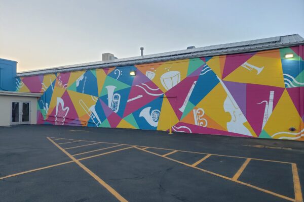 AYSP mural on building exterior